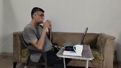 Clean Shaven Man Explains During Laptop Call Using Hand Gestures at Home Desk