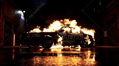 A police car engulfed in intense flames in a dark urban alley at night, low angle view