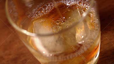 Alcohol (whiskey) pouring in slow motion