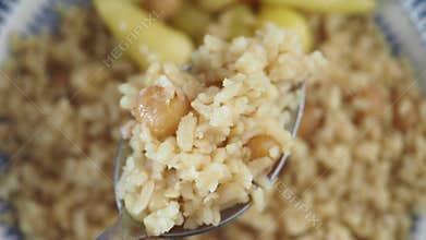 Spoonful of rice with chickpeas