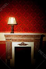 Beautiful vintage interior with lamp on fireplace