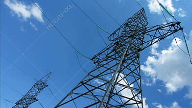 tall electric masts against cloudy sky - timelapse 4k