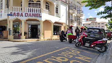 Tourists leaving on scooters in bayahibe, dominican republic