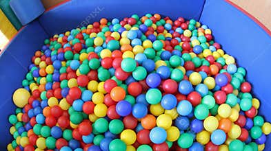 Swimming pool with plenty of colorful plastic balls