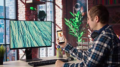 Man in home office looking at social media feed with live broadcasts