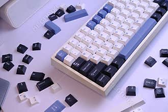 Modern 75% Layout Mechanical Keyboard with White, Blue, and Black Keycaps on a Clean White Desk
