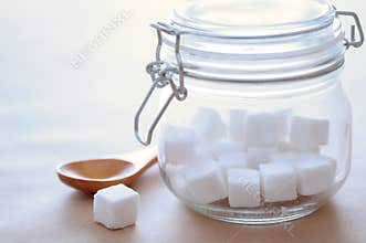 Cube Sugar in Glass Jar with Sunlight – Warm and Minimal Concept