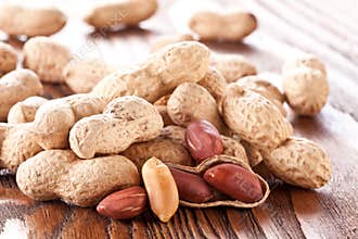 Peanuts on a wooden table.