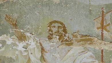 Weathered fresco of Jesus