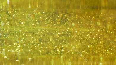 Small bubbles are scattered throughout yellow liquid