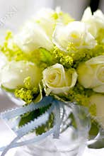 White roses in jar naturally lit