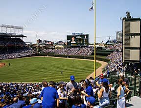 Exciting Baseball Game Atmosphere at Wrigley Field in Chicago With Cheering Fans in Summer