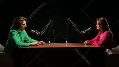 Engaging Conversation Between Influencers in a Dynamic Podcast Recording Studio Setting