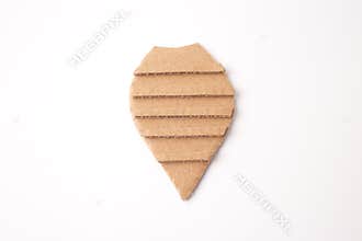 a piece of cardboard cut into a shape resembling an insect body craft. horizontal lines running across it, creative use