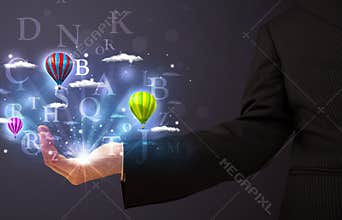 Letters and balloons in the hand of a businessman