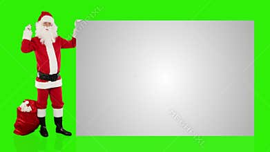 Santa Claus shaking bell presenting a white sheet, Green Screen, stock footage