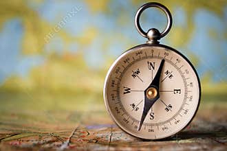 Magnetic compass on a world map