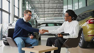 Customer Signing Car Purchase Agreement at Dealership