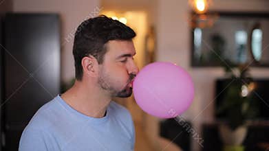 Man making playing with chewing gum