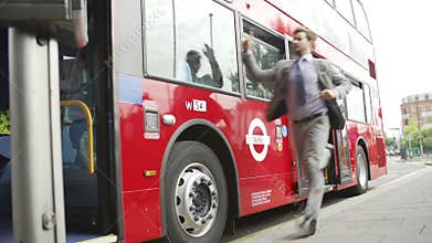 Businessman Running To Catch Bus Stop
