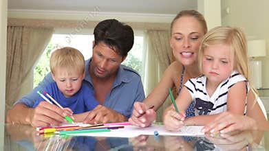 Father helping son and mother