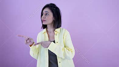Woman confidently dancing to her right and left with a raised brow and a subtle smile.