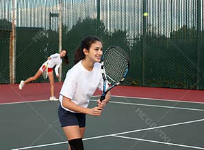 Girls playing tennis
