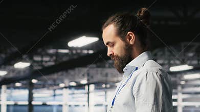 Programmers on data center industrial platform checking code on tablet