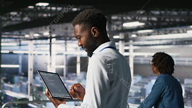 Data center programmers on industrial platform checking lines of code