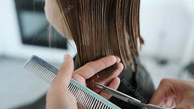 Barber Cutting Little Girl's Hair