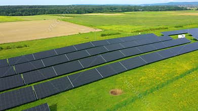 Aerial Drone view of Blue Solar panel farm or solar power plant. Alternative renewable energy with photovoltaic cell industry