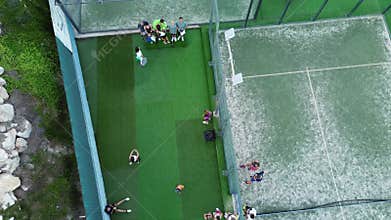 Awarding the winners of the family paddle tennis tournament. The team that took first place climbs to the stands.