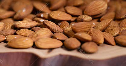 ready-to-eat almond nuts on a wooden table