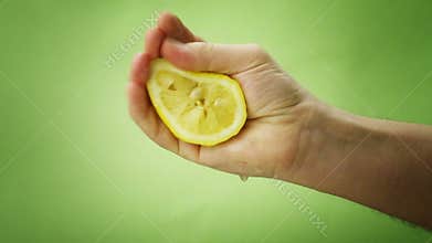 Hand squeezing lemon