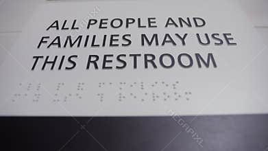 Sign All people and families may use this restroom