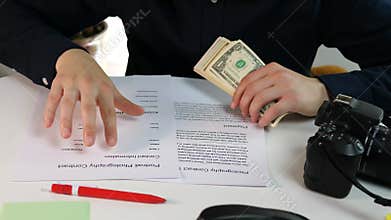 Videographer or photographer for a blogger with a contract for creating photos or videos. Concluding a commercial