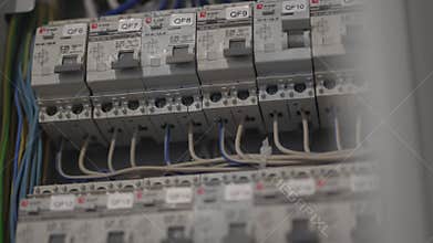 Electric switchboard stands open in testing mode closeup