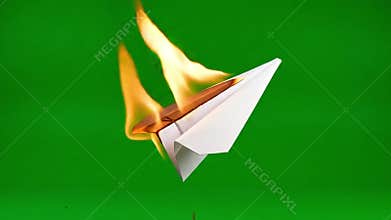 Paper airplane on fire, burning process in sequence against green screen background