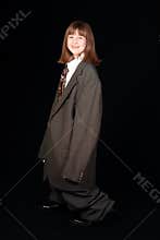 Happy girl in adult suit