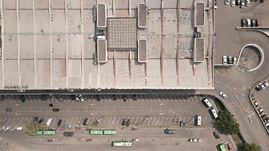 Tbilisi, Georgia - 11th july, 2025: Aerial top down view green buses and vehicles drive in station square by Tbilisi central