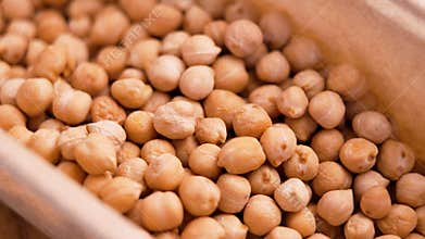 Dried chickpeas in grocery paper packaging.