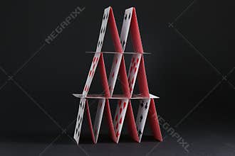 House of playing cards on black background