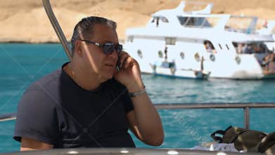 Phone talk on board the ship