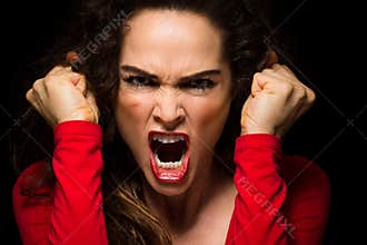 Vary angry woman clenching fists