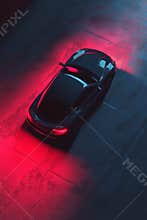 A black car with a red light on the hood