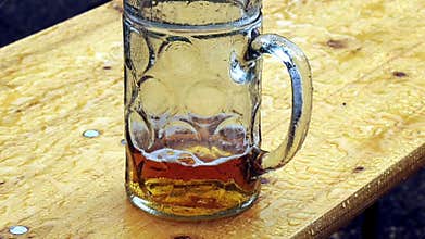 Beer mug in rain
