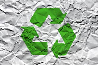 Wrinkled White Paper with Green Recycling Symbol