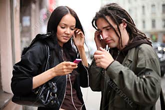 Young couple listening to music