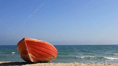 Red boat on beach