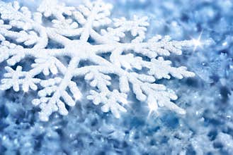 Blue background with ice and a large snowflake